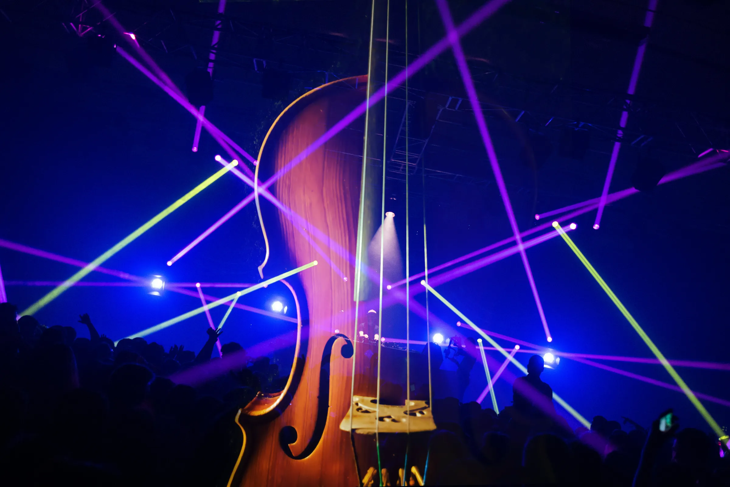 Violin with nightclub scene in the background